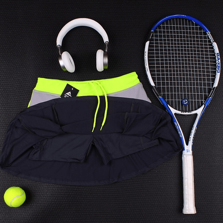 Women's breathable tennis skirt-shorts with pocket, lime green waistband, navy & gray tones, tennis racket, ball, and headphones. SF0217